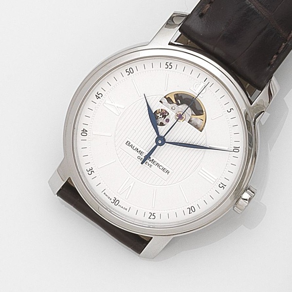 Baume & Mercier. A stainless steel automatic centre seconds wristwatch together with box and papers