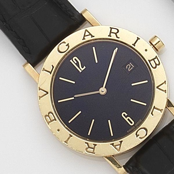 Bulgari. An 18ct gold quartz calendar wristwatch