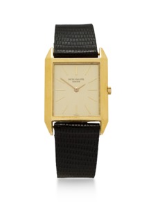 Patek Philippe. An 18K gold thin tank wristwatch