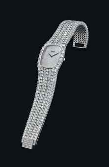 PIAGET. AN IMPRESSIVE 18K WHITE GOLD AND DIAMOND-SET RECTANGULAR BRACELET WATCH
