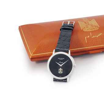 Patek Philippe. A fine and rare 18K white gold automatic wristwatch, with the Iraqi Eagle and original box