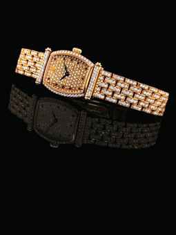 AUDEMARS PIGUET. A LADY'S FINE 18K PINK GOLD, DIAMOND AND RUBY-SET TONNEAU-SHAPED BRACELET WATCH