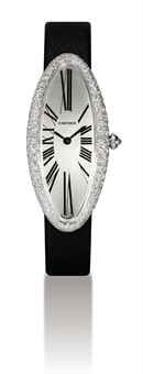 CARTIER. A LADY'S FINE 18K WHITE GOLD AND DIAMOND-SET ELONGATED OVAL WRISTWATCH