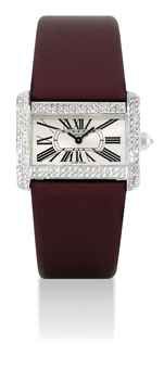 CARTIER. A LADY'S FINE 18K WHITE GOLD AND DIAMOND-SET RECTANGULAR WRISTWATCH