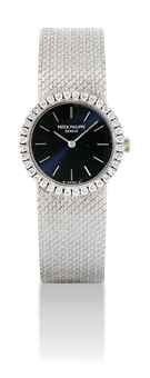 PATEK PHILIPPE. A LADY'S 18K WHITE GOLD AND DIAMOND-SET BRACELET WATCH