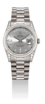 ROLEX. A FINE AND RARE 18K WHITE GOLD AND DIAMOND-SET AUTOMATIC WRISTWATCH WITH SWEEP CENTRE SECONDS, DAY, DATE AND BRACELET