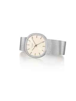 PATEK PHILIPPE. A FINE 18K WHITE GOLD CUSHION-SHAPED AUTOMATIC BRACELET WATCH WITH SWEEP CENTRE SECONDS