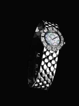 PATEK PHILIPPE. A LADY'S FINE AND RARE 18K WHITE GOLD AND DIAMOND-SET FLORAL-SHAPED BRACELET WATCH WITH MOTHER-OF-PEARL DIAL