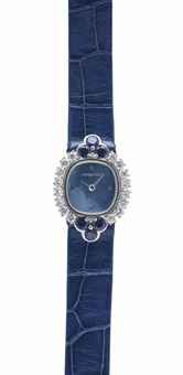 AUDEMARS PIGUET. A LADY'S ELEGANT 18K WHITE GOLD, DIAMOND AND SAPPHIRE-SET WRISTWATCH