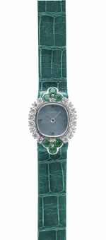 AUDEMARS PIGUET. A LADY'S ELEGANT 18K WHITE GOLD, DIAMOND AND EMERALD-SET WRISTWATCH