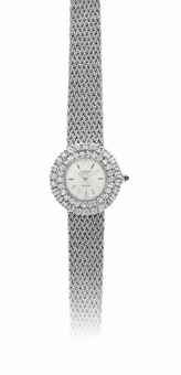 AUDEMARS PIGUET. A LADY'S 18K WHITE GOLD AND DIAMOND-SET BRACELET WATCH, RETAILED BY BVLGARI