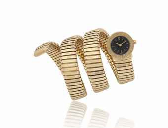 BVLGARI. AN UNUSUAL LADY'S 18K GOLD BANGLE WATCH