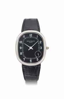 Patek Philippe. An 18K white gold oval automatic wristwatch with black dial and eccentric subsidiary seconds