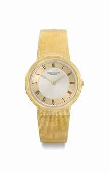 Patek Philippe. A fine and unusual 18K gold wristwatch with two-tone champagne dial and bracelet