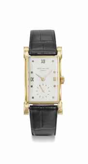 Patek Philippe. A fine and unusual 18K gold rectangular wristwatch with stepped case