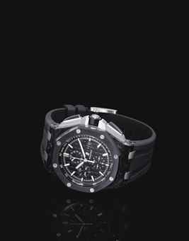 AUDEMARS PIGUET. AN OVERSIZED FORGED CARBON, TITANIUM AND CERAMIC AUTOMATIC CHRONOGRAPH WRISTWATCH WITH DATE