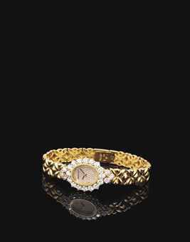 AUDEMARS PIGUET. A LADY'S 18K GOLD AND DIAMOND-SET OVAL BRACELET WATCH