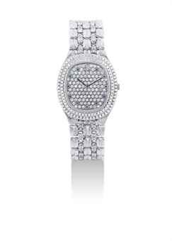 AUDEMARS PIGUET. A FINE 18K WHITE GOLD DIAMOND AND SAPPHIRE-SET OVAL BRACELET WATCH