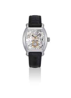 VACHERON CONSTANTIN. A FINE AND RARE PLATINUM TONNEAU-SHAPED SKELETONISED TOURBILLON WRISTWATCH WITH DATE AND POWER RESERVE