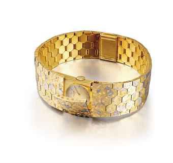 PATEK PHILIPPE. A LADY'S FINE AND VERY RARE 18K THREE-COLOUR GOLD BRACELET WATCH WITH CONCEALED DIAL
