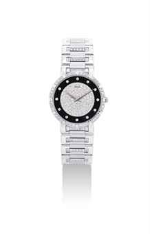 PIAGET. AN 18K WHITE GOLD AND DIAMOND-SET WRISTWATCH WITH BRACELET AND ONYX DIAL