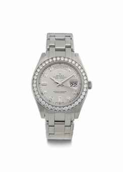 Rolex. A Fine Platinum and Diamond-Set Automatic Wristwatch with Center Seconds, Day, Date, and Bracelet