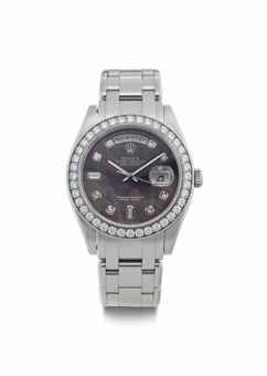 Rolex. A Very Fine Platinum and Diamond-Set Automatic Wristwatch with Center Seconds, Day, Date, Mother-of-Pearl Dial, and Bracelet
