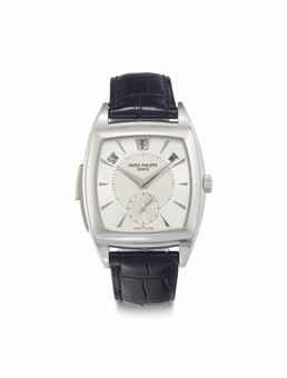 Patek Philippe. A Very Rare and Fine Platinum Tonneau-Shaped Automatic Minute Repeating Annual Calendar Wristwatch with Original Certificate, Additional Hard Back, and Presentation Box