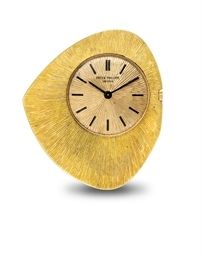 PATEK PHILIPPE. AN 18K GOLD OPENFACE ASYMMETRICAL KEYLESS LEVER DRESS WATCH