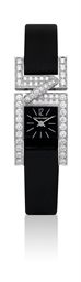 CHAUMET. A LADY'S 18K WHITE GOLD AND DIAMOND-SET RECTANGULAR WRISTWATCH