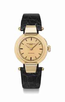 Patek Philippe. A fine, rare and attractive 18K pink gold wristwatch with pink dial and hinged hooded lugs