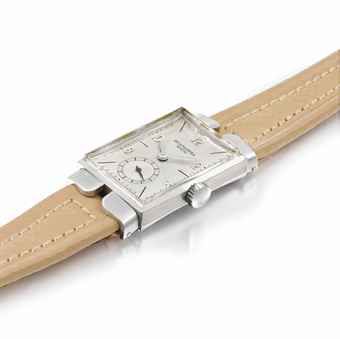 Patek Philippe. A very rare and highly unusual stainless steel rectangular courtesy watch with two-piece hooded lugs