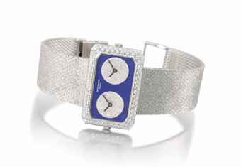 PATEK PHILIPPE. A VERY FINE AND RARE 18K WHITE GOLD AND DIAMOND-SET DUAL TIME BRACELET WATCH WITH LAPIS LAZULI DIAL