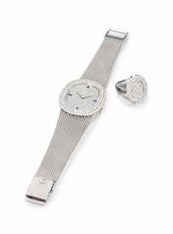 PATEK PHILIPPE. A VERY FINE AND RARE 18K WHITE GOLD, DIAMOND AND SAPPHIRE-SET OVAL WRISTWATCH WITH BRACELET AND AN 18K WHITE GOLD AND DIAMOND-SET RING