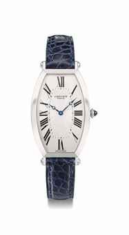 Cartier. A fine platinum tonneau-shaped curved wristwatch