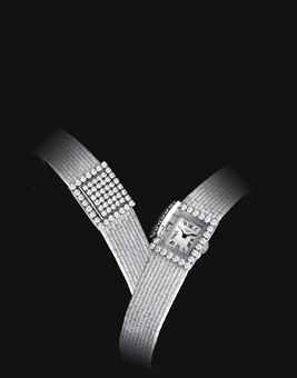 PATEK PHILIIPE. A LADY'S FINE AND RARE 18K WHITE GOLD AND DIAMOND-SET RECTANGULAR BRACELET WATCH WITH CONCEALED DIAL