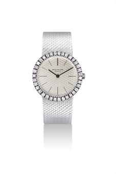 PATEK PHILIPPE. A LADY'S 18K WHITE GOLD AND DIAMOND-SET BRACELET WATCH