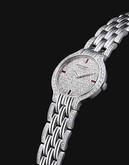 PATEK PHILIPPE. A FINE AND RARE 18K WHITE GOLD, DIAMOND AND RUBY-SET BRACELET WATCH