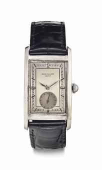 Patek Philippe. A Rare and Early Large Curved Rectangular Staybrite Steel Wristwatch with Later Dial