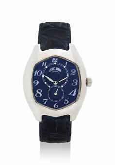 CÉDRIC JOHNER. AN 18K WHITE GOLD AUTOMATIC TONNEAU-SHAPED WRISTWATCH