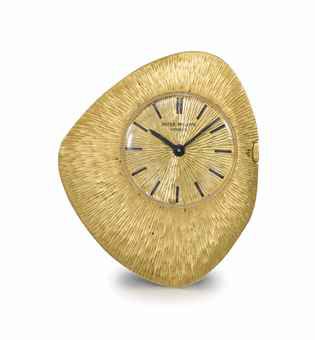 Patek Philippe. A fine, rare and unusual 18K gold asymmetrical keyless lever watch