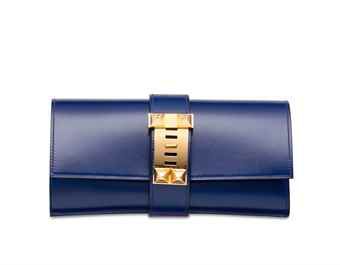 A BLEU SAPHIR TADELAKT LEATHER MÉDOR 23 WITH GOLD HARDWARE