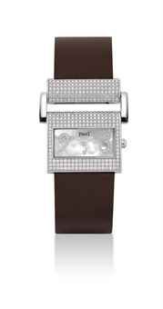 PIAGET. A LADY'S 18K WHITE GOLD AND DIAMOND-SET RECTANGULAR WRISTWATCH WITH MOTHER-OF-PEARL DIAL