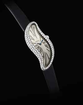 CARTIER. A LADY'S FINE 18K WHITE GOLD AND DIAMOND-SET ASYMMETRICAL WRISTWATCH