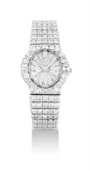 PIAGET. A MAGNIFICENT AND VERY RARE 18K WHITE GOLD AND DIAMOND-SET BRACELET WATCH