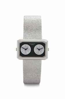 Patek Philippe. A Lady's Unusual and Attractive 18k White Gold, Onyx, and Diamond-set Dual Time Wristwatch