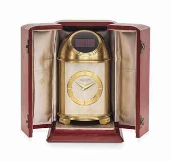 PATEK PHILIPPE. A FINE AND VERY RARE GILT BRASS SOLAR-POWERED DOME TABLE CLOCK WITH BOX