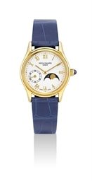 PATEK PHILIPPE. A LADY'S 18K GOLD WRISTWATCH WITH MOON PHASES
