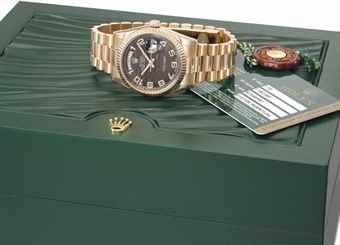 Rolex. A fine and unusual 18K pink gold automatic wristwatch with sweep centre seconds day, date, two-tone dial, garantie and box