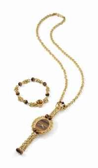 Piaget. A very fine, elegant and unusual 18K gold and tiger's eye necklace watch with matching bracelet